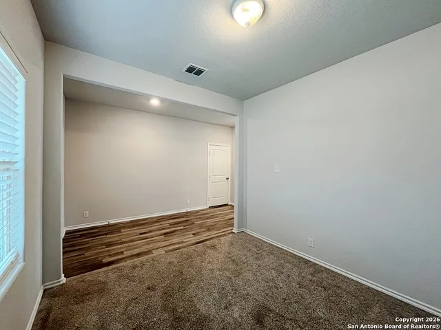 a kitchen with kitchen island a sink stainless steel appliances and cabinets