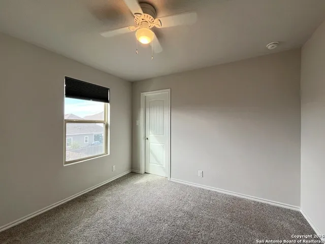 a view of a room with a wooden floor