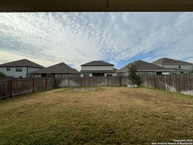 a view of a swimming pool with a table and chairs