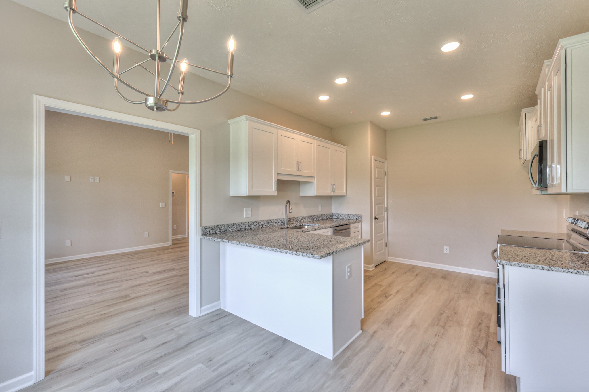 201 North Fork Branch Road Tullahoma, TN 37388 - Photo 15 of 31 a kitchen with a sink a refrigerator and a stove