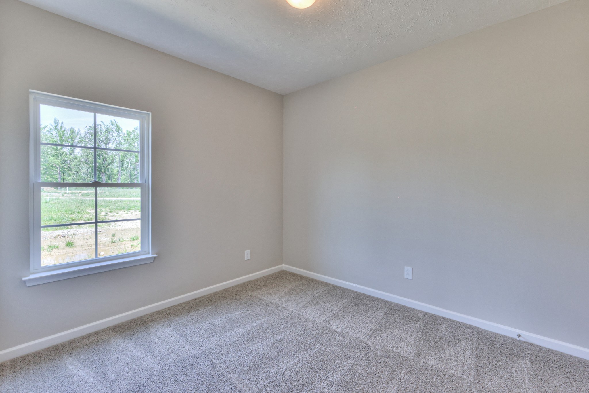 201 North Fork Branch Road Tullahoma, TN 37388 - Photo 22 of 31 an empty room with a window
