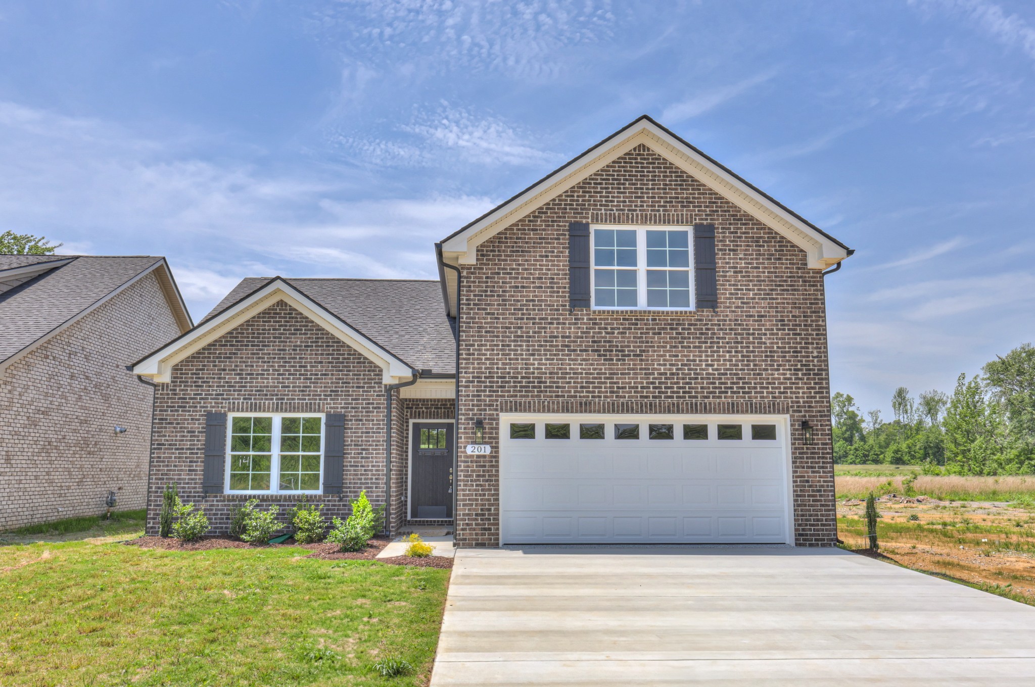 201 North Fork Branch Road Tullahoma, TN 37388 - Photo 3 of 31 a front view of house with yard and garage