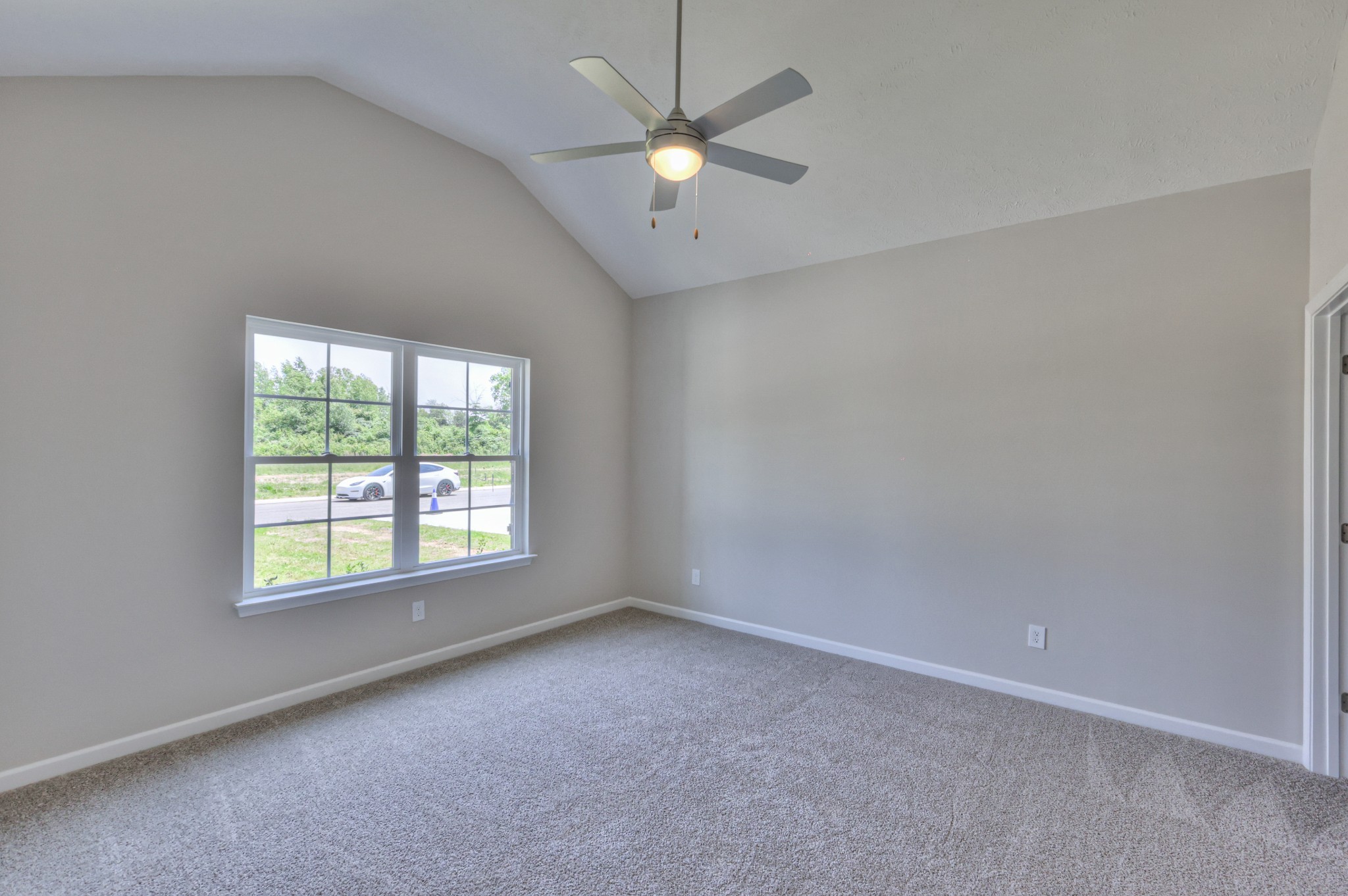 201 North Fork Branch Road Tullahoma, TN 37388 - Photo 6 of 31 an empty room with a window and a fan