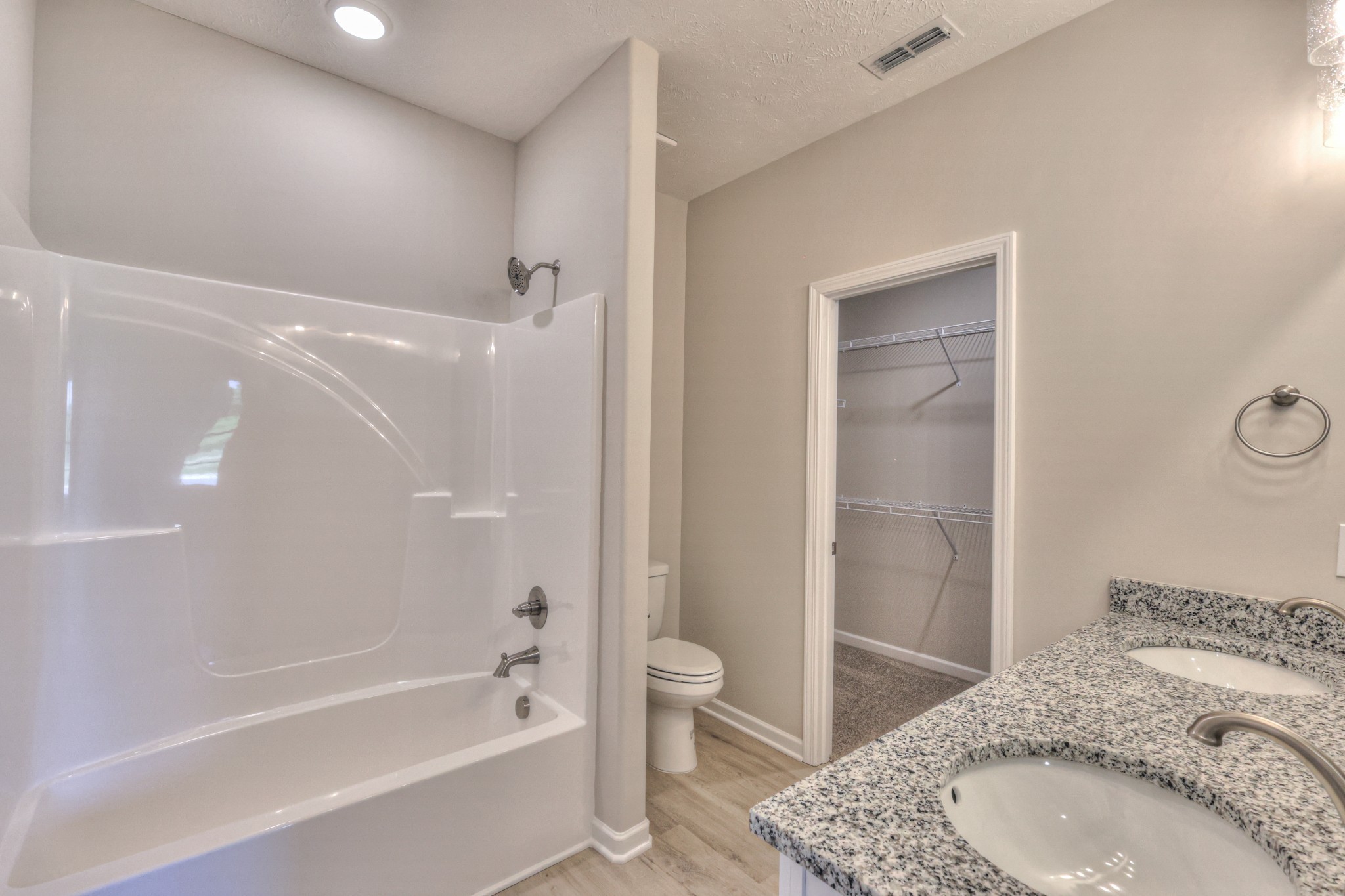 201 North Fork Branch Road Tullahoma, TN 37388 - Photo 8 of 31 a bathroom with a granite countertop sink a toilet and shower