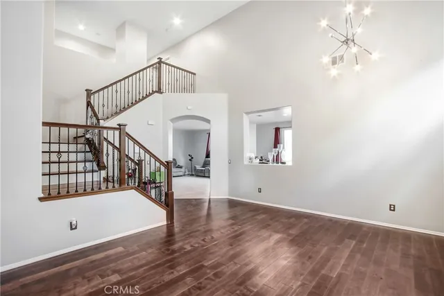 a view of entryway with stairs and wooden floor