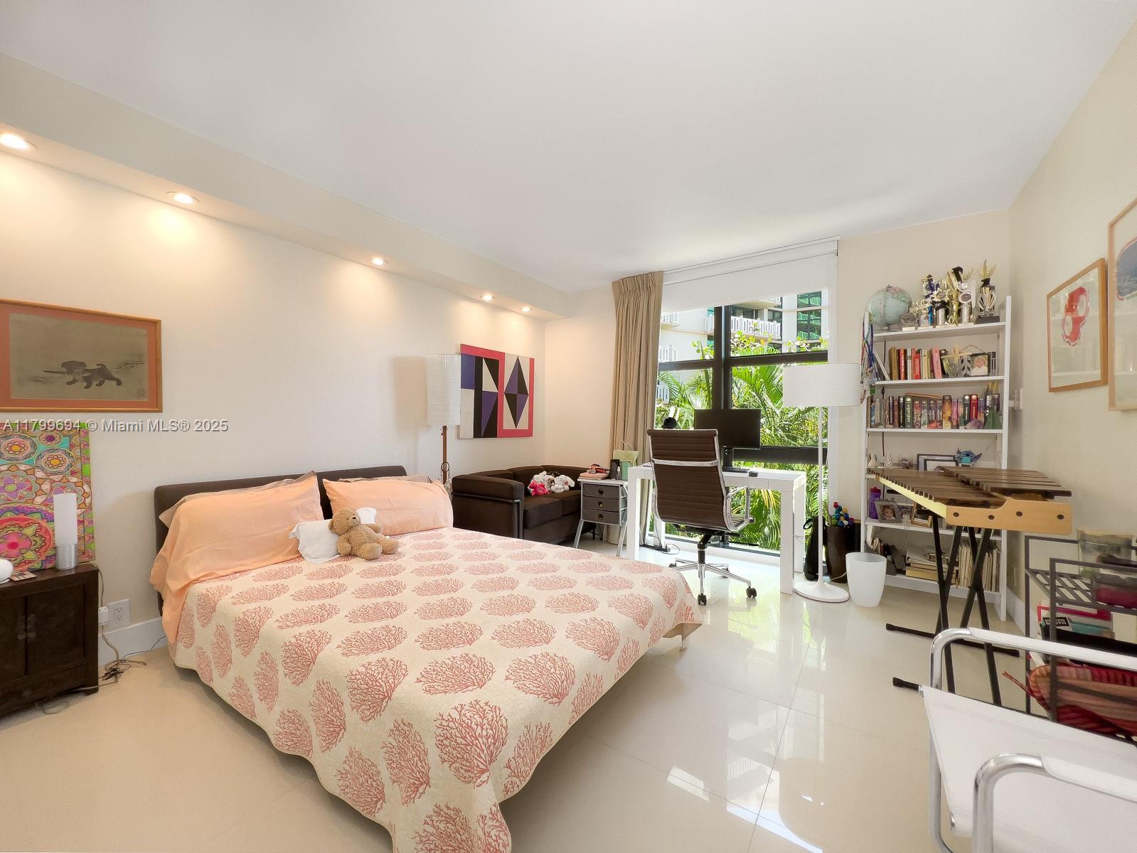 1121 Crandon Boulevard, Unit E307 Key Biscayne, FL 33149 - Photo 12 of 30 a bed room with a bed and furniture