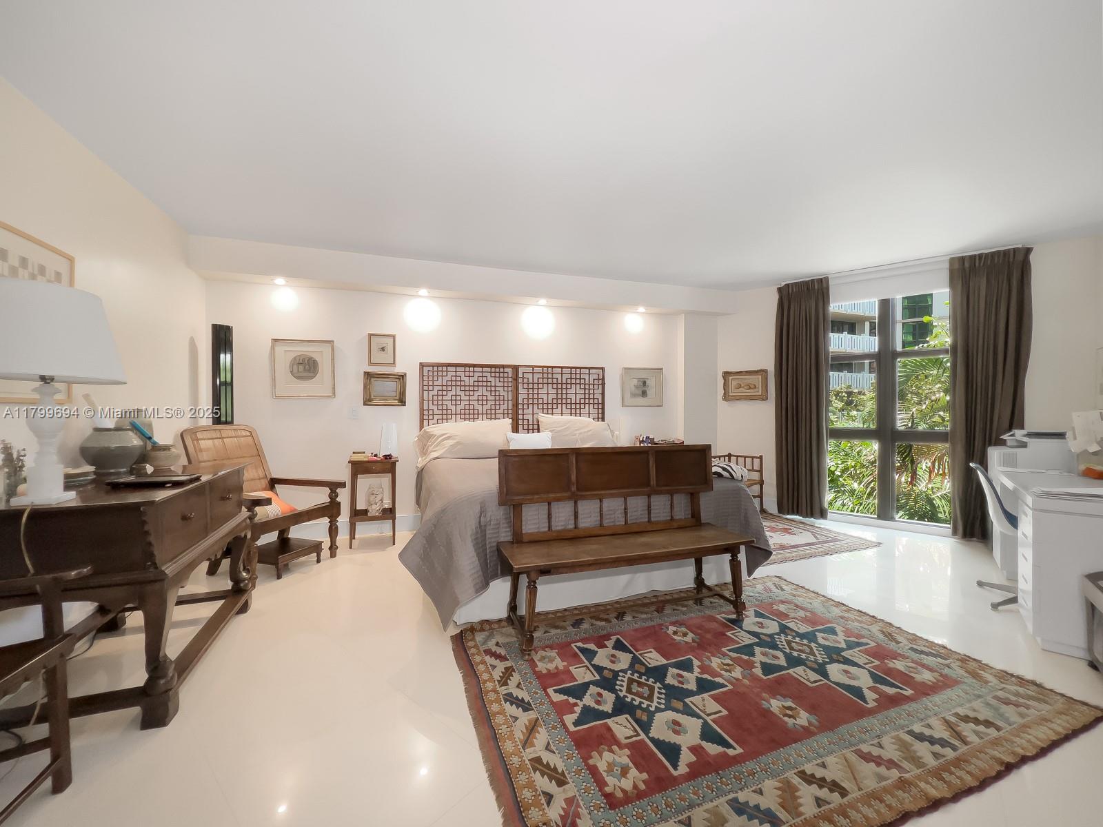 1121 Crandon Boulevard, Unit E307 Key Biscayne, FL 33149 - Photo 14 of 30 a living room with furniture rug and window