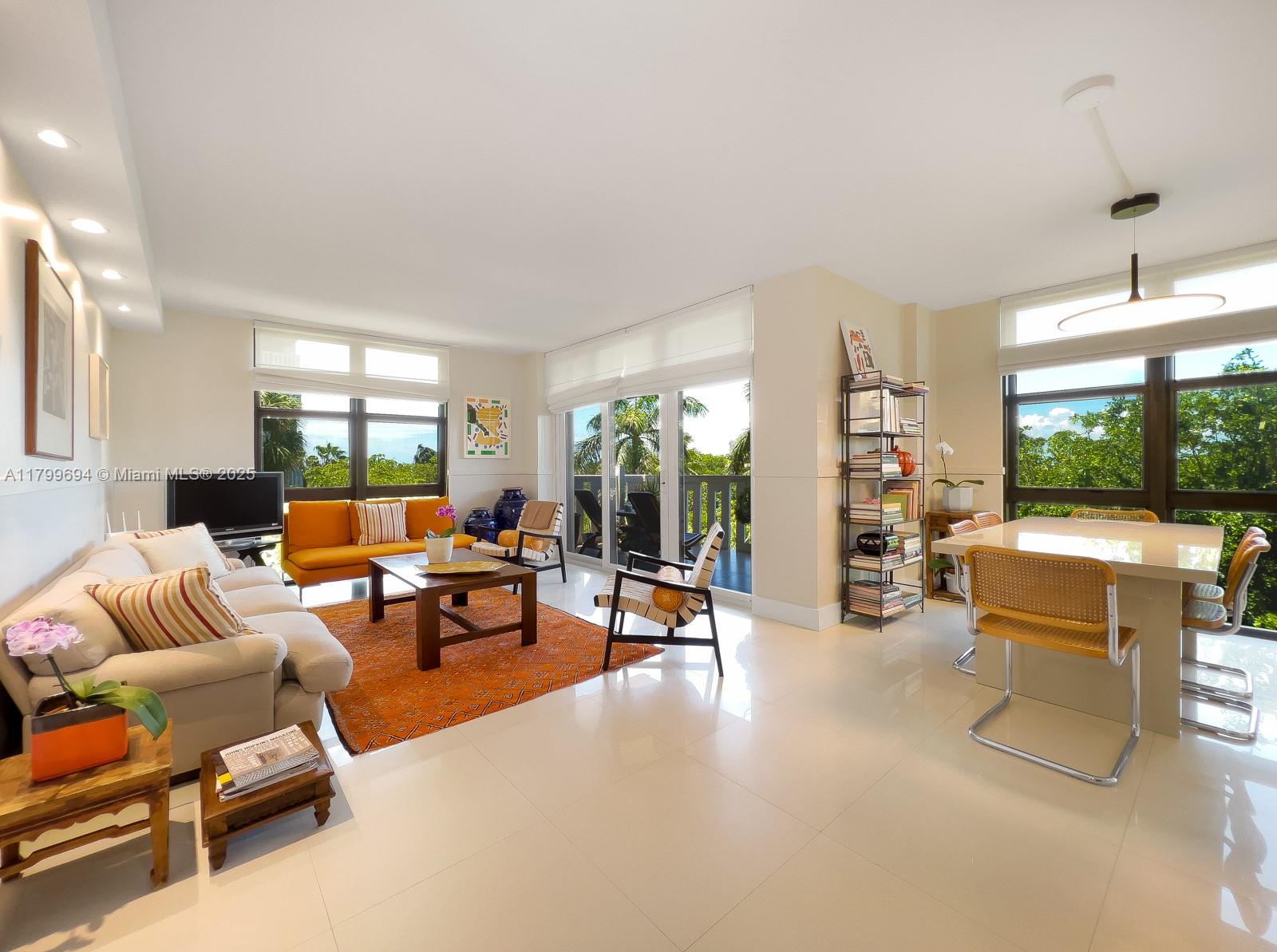 1121 Crandon Boulevard, Unit E307 Key Biscayne, FL 33149 - Photo 2 of 30 a living room with furniture and a large window