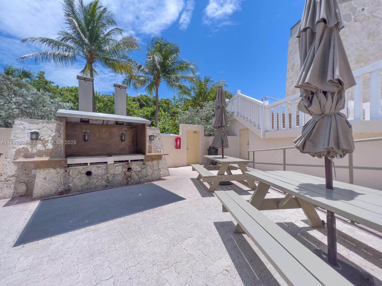 1121 Crandon Boulevard, Unit E307 Key Biscayne, FL 33149 - Photo 25 of 30 a view of a house with a patio