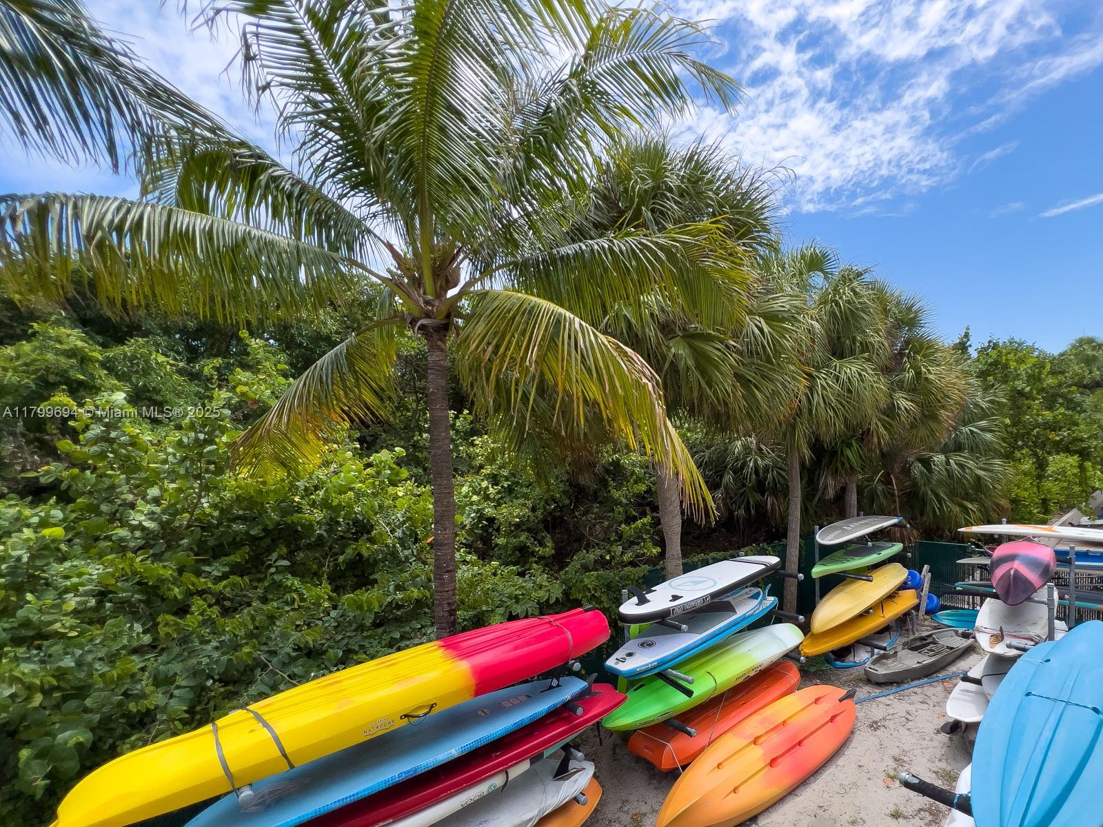 1121 Crandon Boulevard, Unit E307 Key Biscayne, FL 33149 - Photo 26 of 30 a view of a backyard with swimming pool