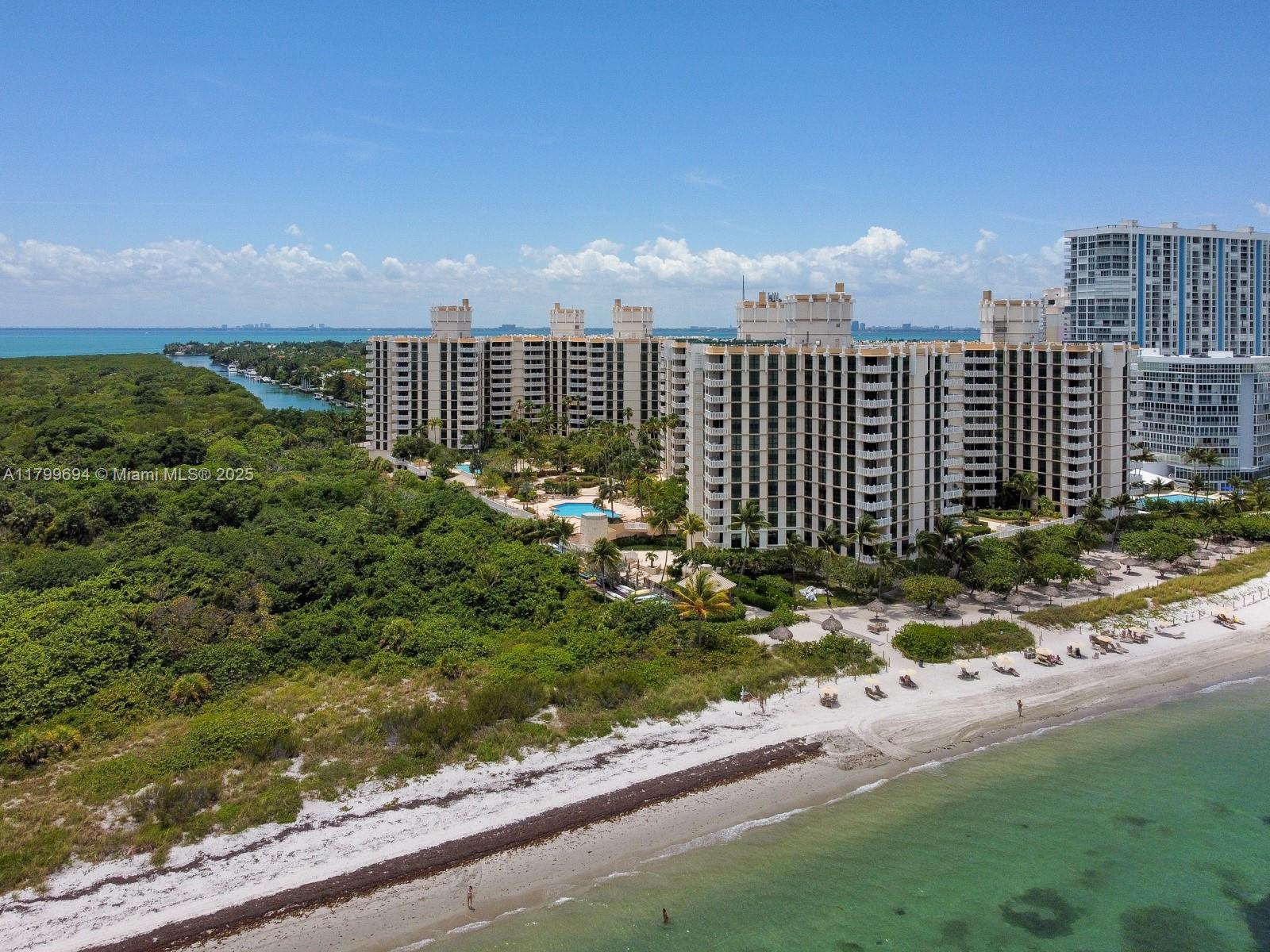 1121 Crandon Boulevard, Unit E307 Key Biscayne, FL 33149 - Photo 28 of 30 a view of a terrace with a yard