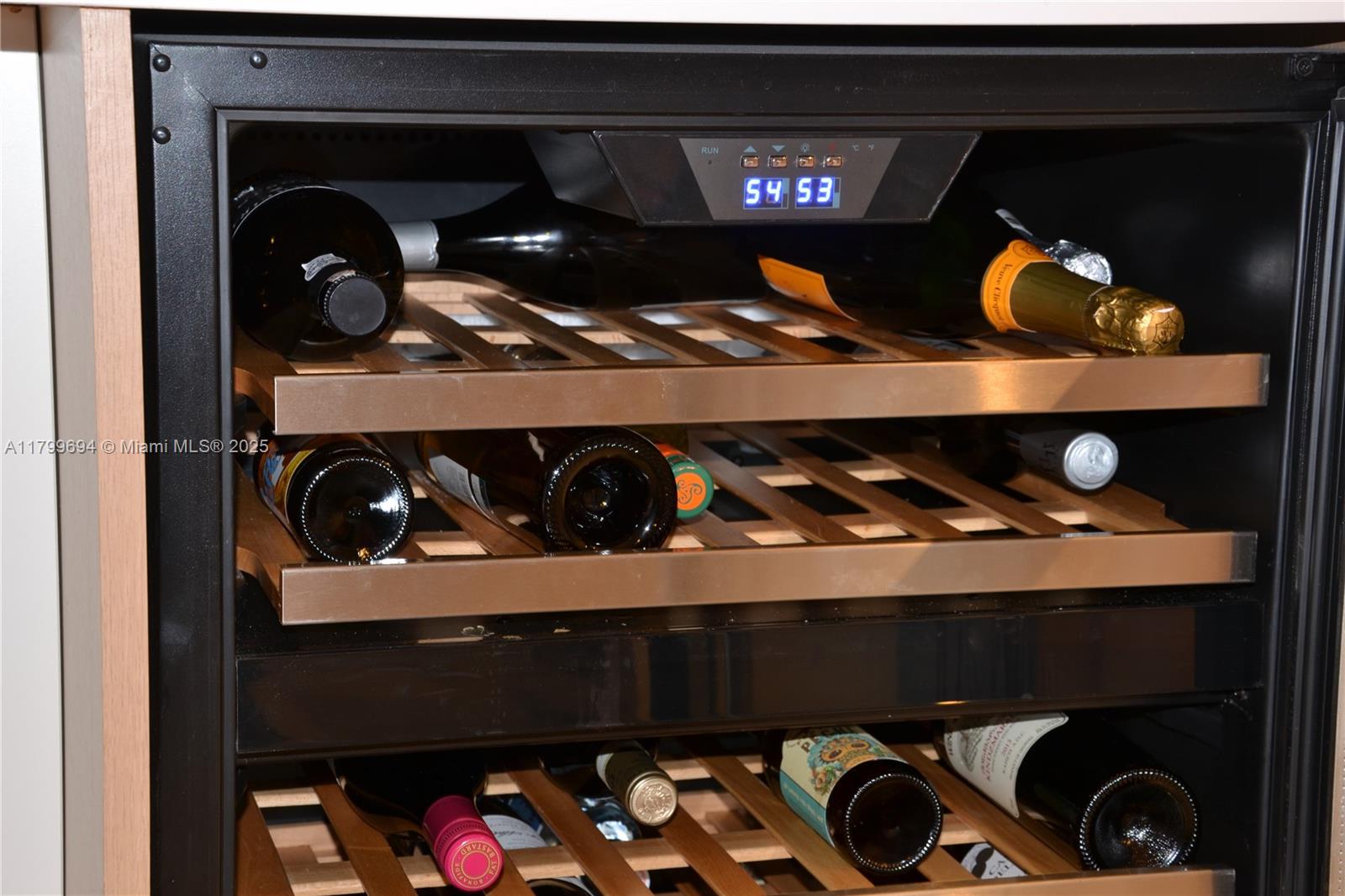 1121 Crandon Boulevard, Unit E307 Key Biscayne, FL 33149 - Photo 8 of 30 a close view of shoes stand and cabinets