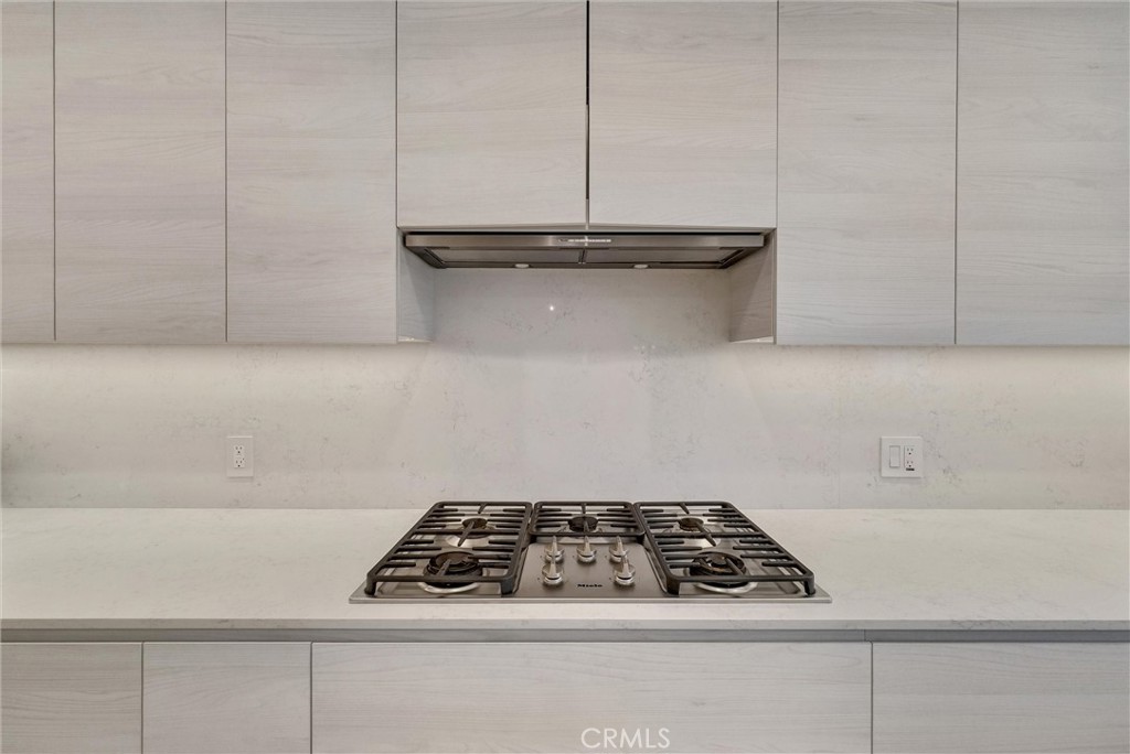 1145 Rancho Road Arcadia, CA 91006 - Photo 17 of 60 a white stove top oven sitting inside of a kitchen