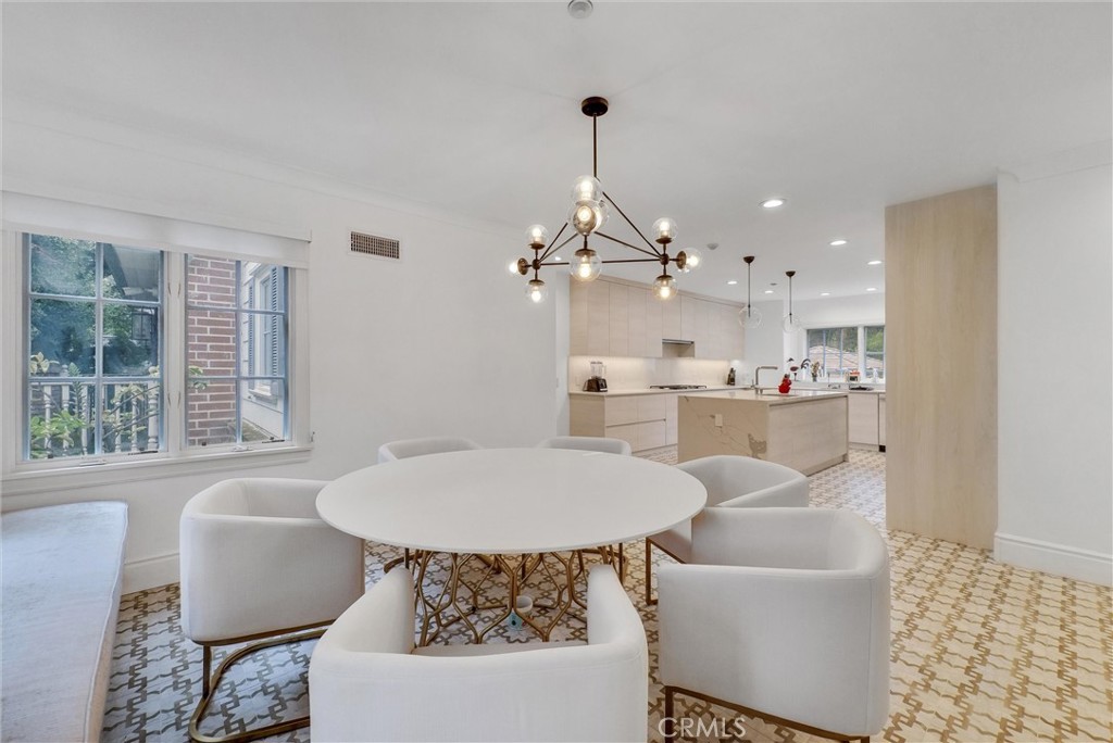 1145 Rancho Road Arcadia, CA 91006 - Photo 19 of 60 a living room with furniture and a chandelier