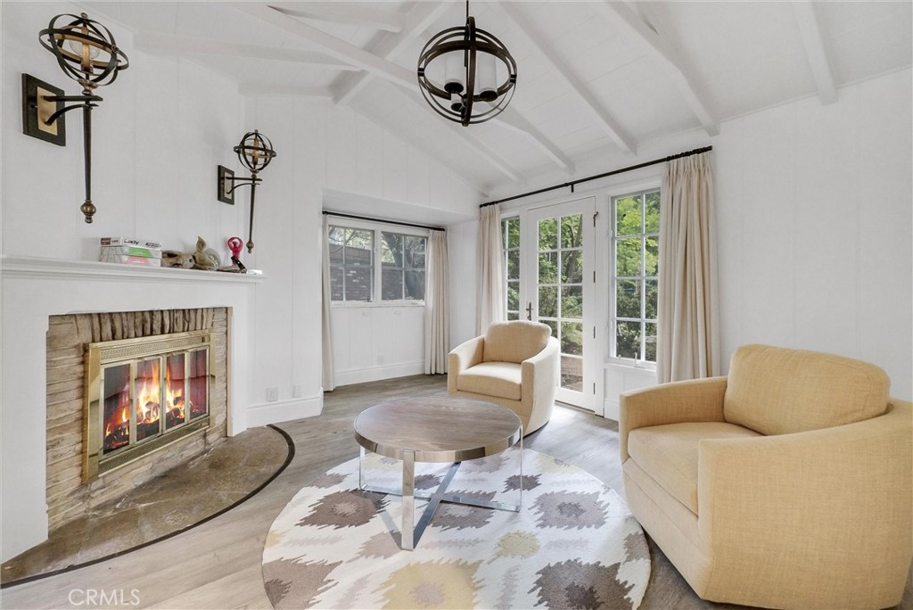 1145 Rancho Road Arcadia, CA 91006 - Photo 27 of 60 a living room with furniture and a fireplace