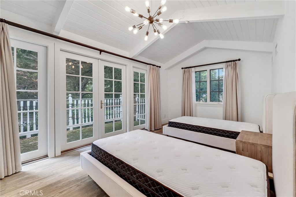 1145 Rancho Road Arcadia, CA 91006 - Photo 31 of 60 a bedroom with a large bed and a large window