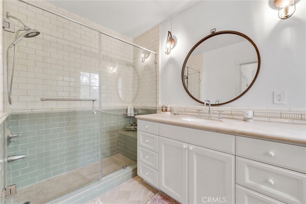 1145 Rancho Road Arcadia, CA 91006 - Photo 39 of 60 a bathroom with a double vanity sink and a mirror