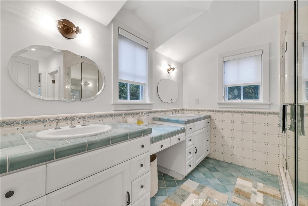 1145 Rancho Road Arcadia, CA 91006 - Photo 42 of 60 a bathroom with a double vanity sink and a mirror