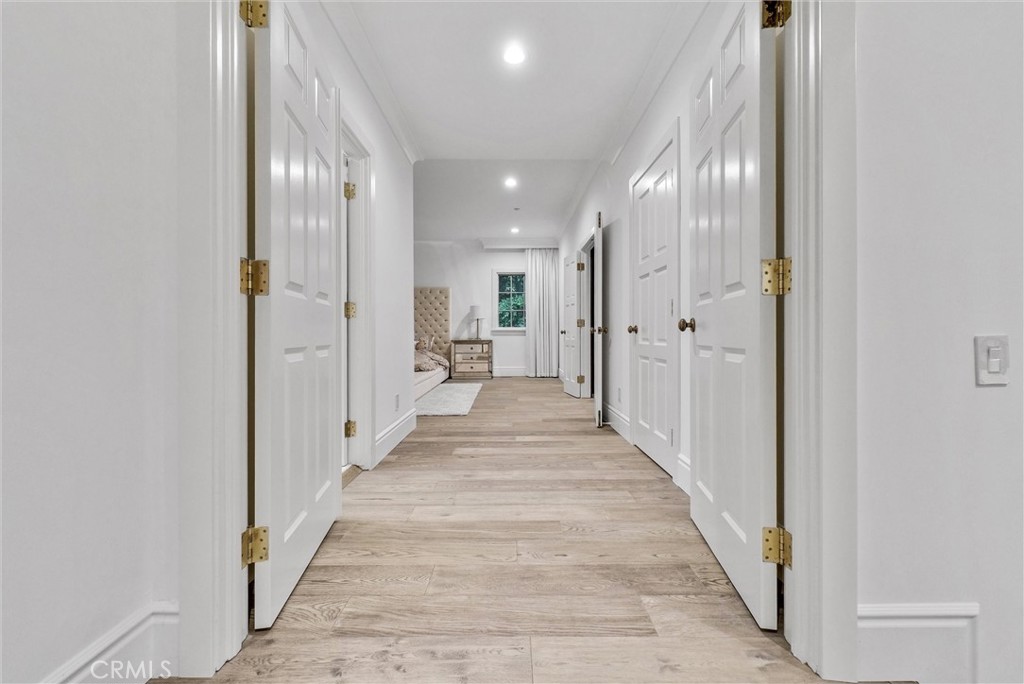1145 Rancho Road Arcadia, CA 91006 - Photo 46 of 60 a view of a hallway with a white walls and stairs