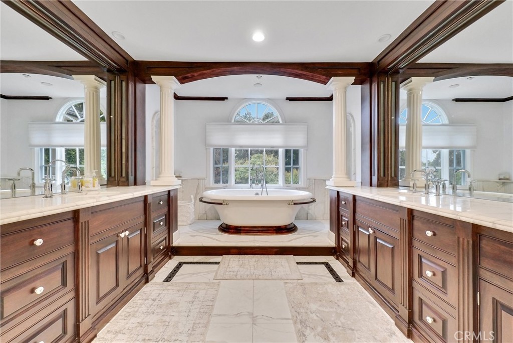 1145 Rancho Road Arcadia, CA 91006 - Photo 47 of 60 a bathroom with a double vanity sink a mirror and a bathtub