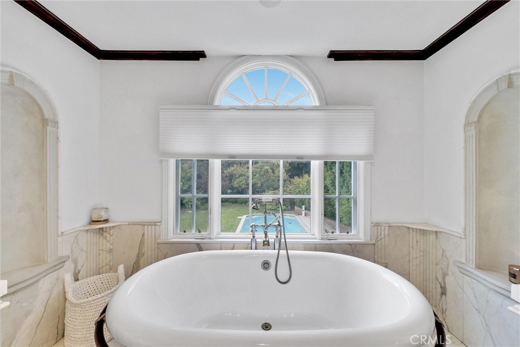 1145 Rancho Road Arcadia, CA 91006 - Photo 48 of 60 a white bath tub sitting in a bathroom