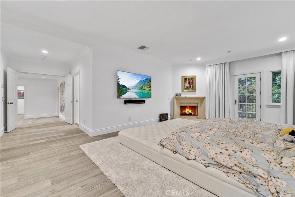 1145 Rancho Road Arcadia, CA 91006 - Photo 53 of 60 a bedroom with a bed and a flat screen tv