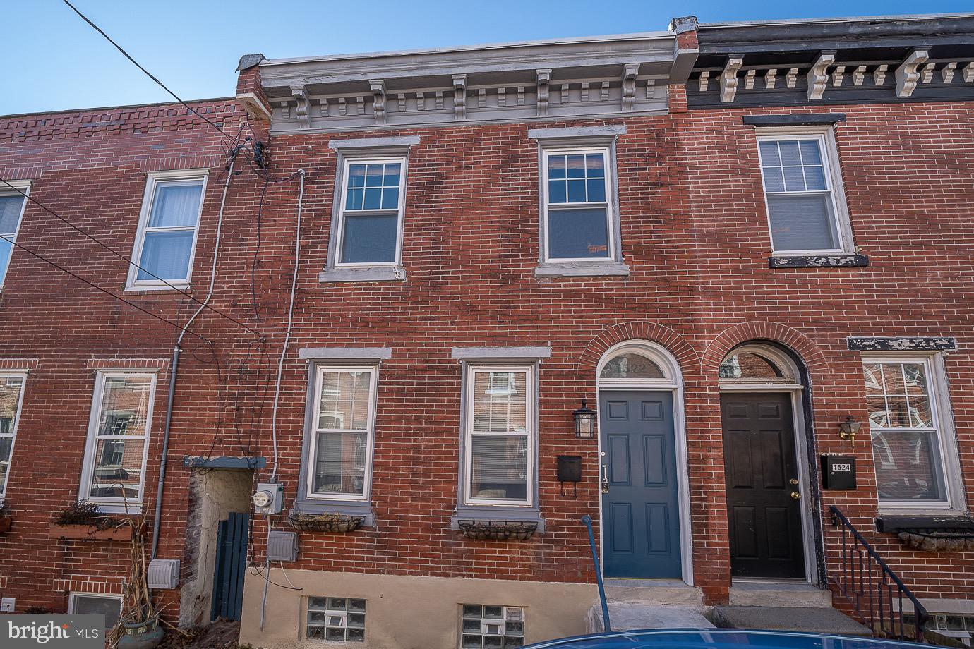 a front view of a building with windows