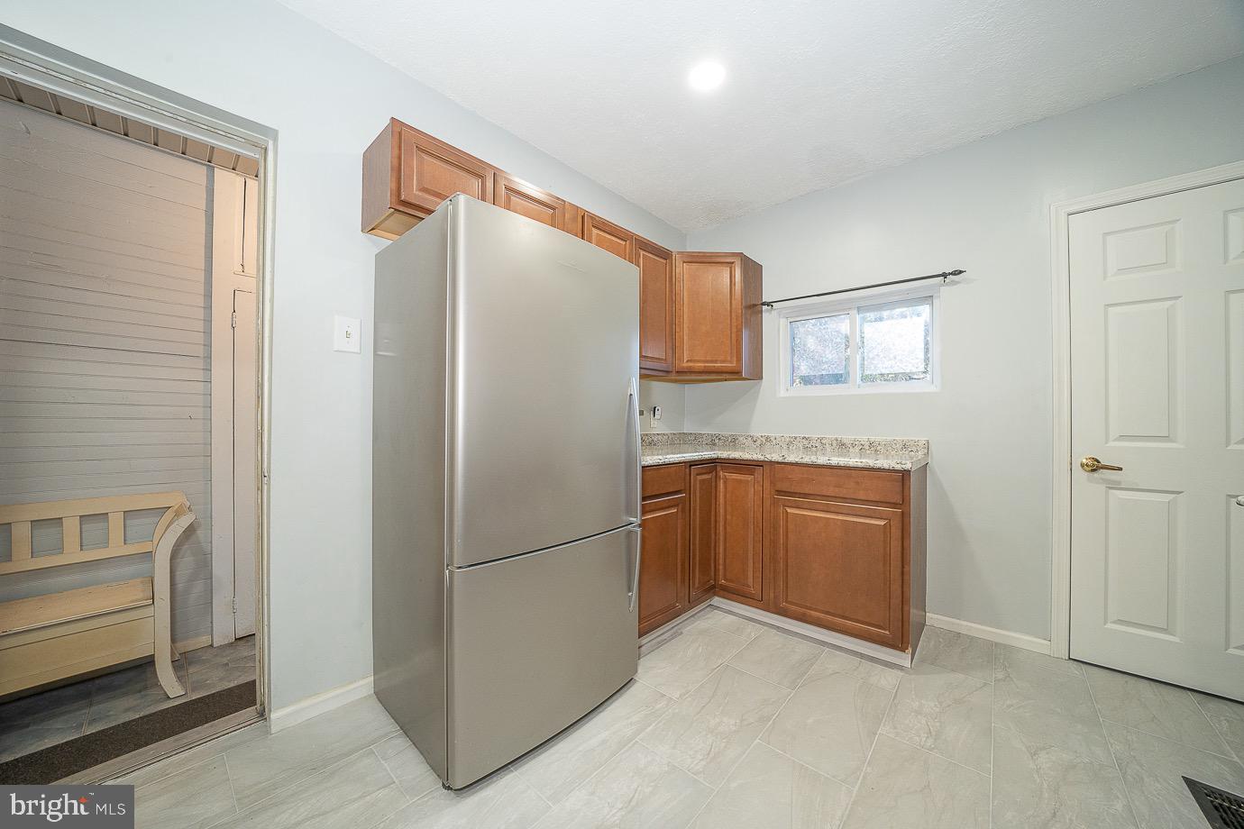 4522 Smick Street Philadelphia, PA 19127 - Photo 16 of 36 a kitchen with a refrigerator and cabinets