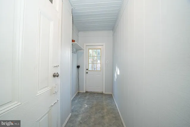 a view of a bathroom from a hallway