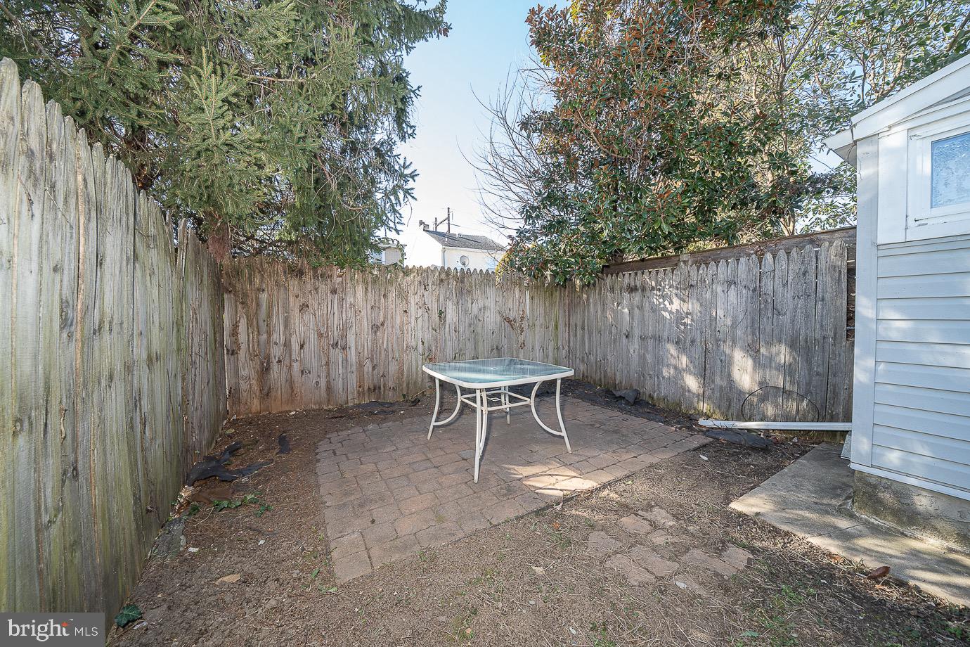 4522 Smick Street Philadelphia, PA 19127 - Photo 21 of 36 a backyard of a house with table and chairs