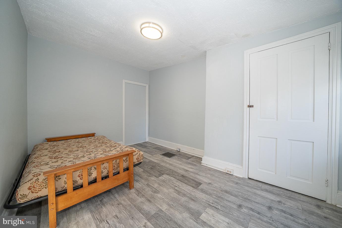 4522 Smick Street Philadelphia, PA 19127 - Photo 26 of 36 a room with a bed and a night stand