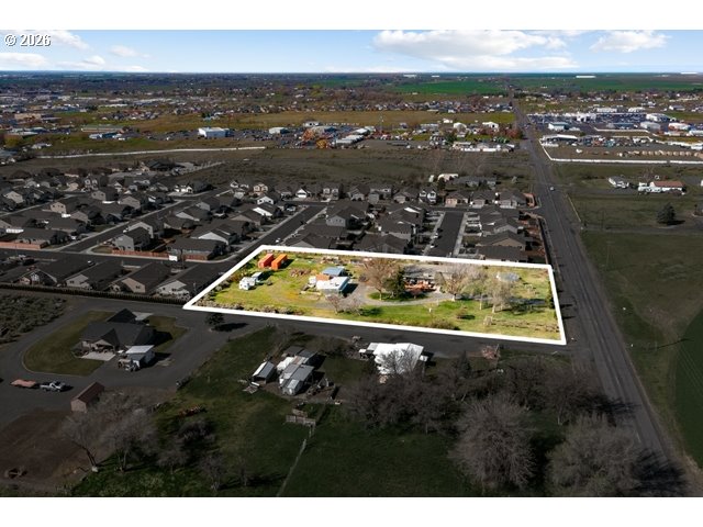 526 East Punkin Center Road Hermiston, OR 97838 - Photo 46 of 48 an aerial view of residential houses with outdoor space