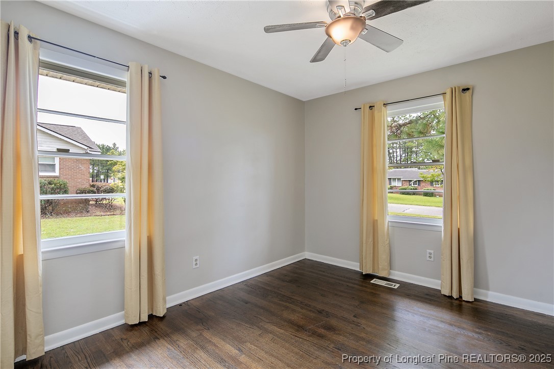 4914 Pinewood Drive Hope Mills, NC 28348 - Photo 19 of 36 a view of an empty room with wooden floor and a window