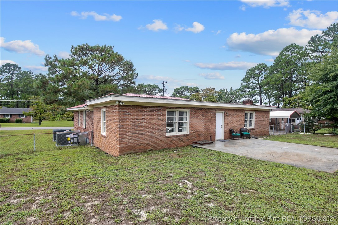 4914 Pinewood Drive Hope Mills, NC 28348 - Photo 33 of 36 a view of a yard in front of a house with large tree