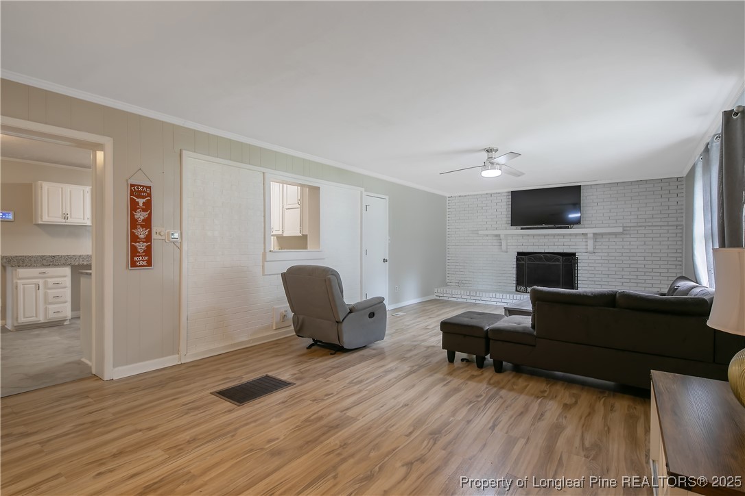 4914 Pinewood Drive Hope Mills, NC 28348 - Photo 9 of 36 a living room with furniture and a fireplace
