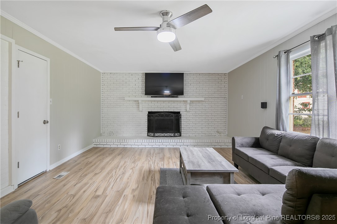 4914 Pinewood Drive Hope Mills, NC 28348 - Photo 10 of 36 a living room with furniture and a flat screen tv