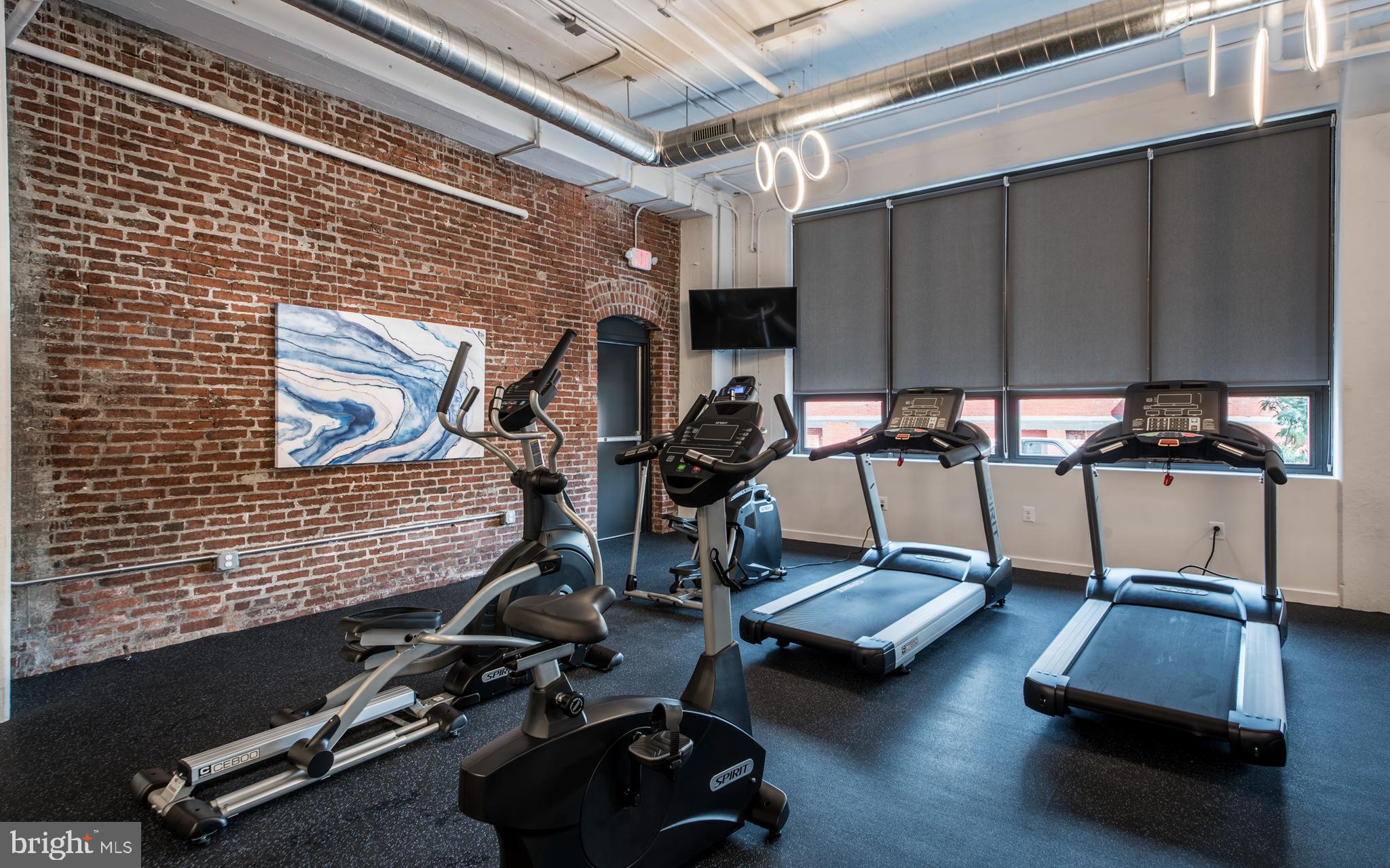 1201 Jackson Street, Unit 516 Philadelphia, PA 19148 - Photo 23 of 42 a room with gym equipment