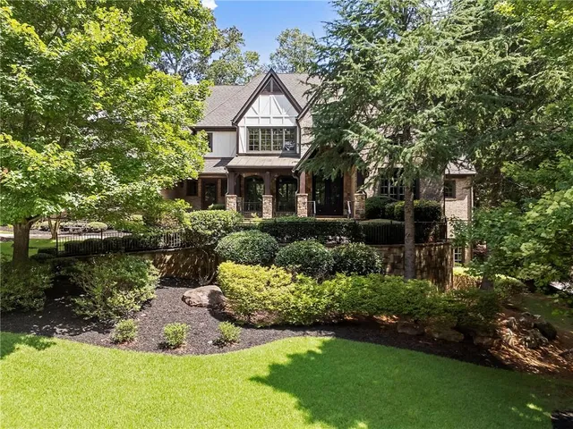 a front view of a house with garden