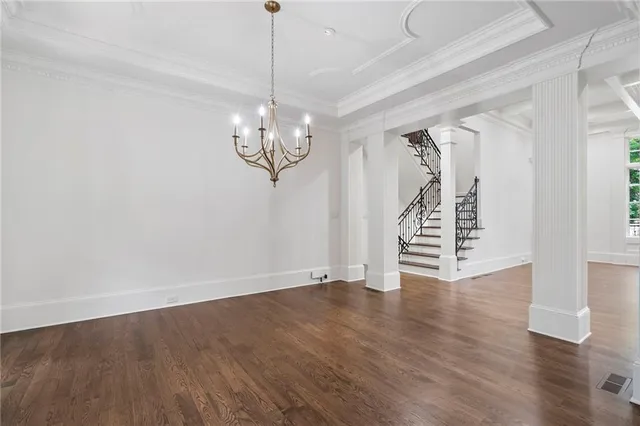 a view of kitchen with stainless steel appliances granite countertop a sink and a refrigerator