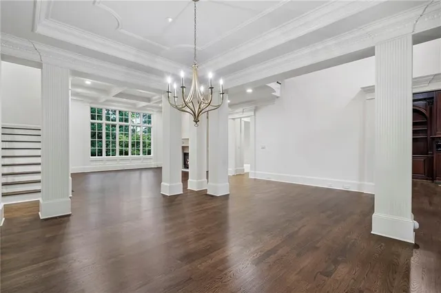 a kitchen with kitchen island granite countertop a sink stainless steel appliances and cabinets
