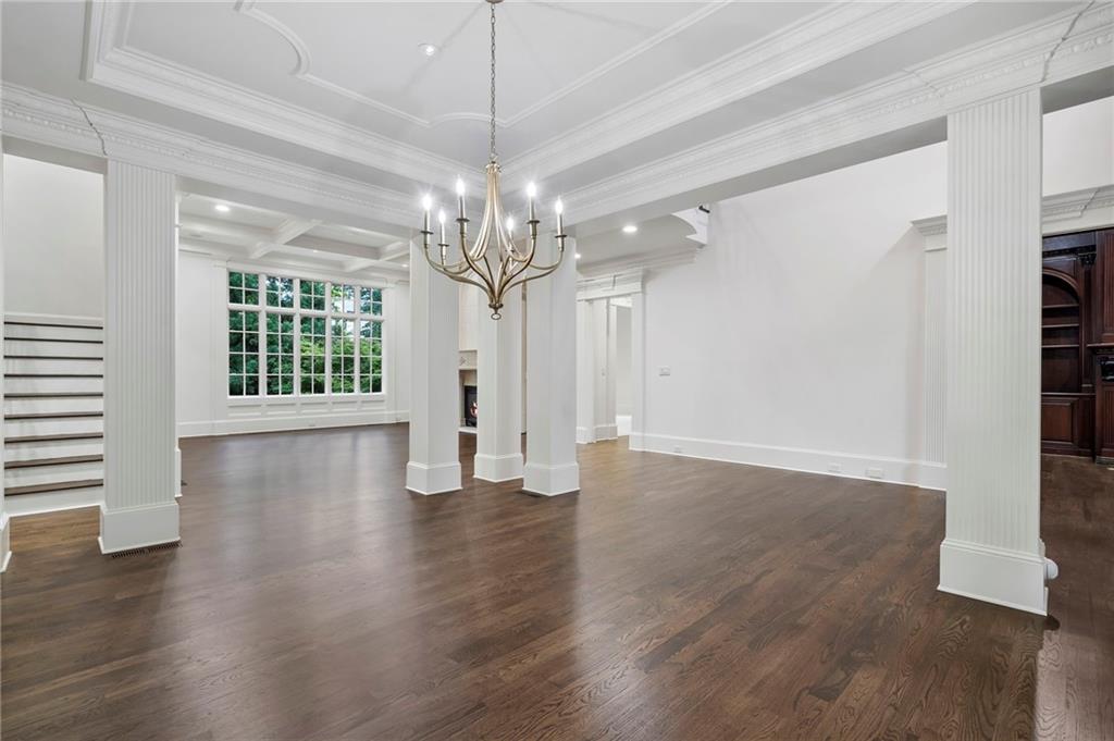 989 Middle Fork Trail Suwanee, GA 30024 - Photo 15 of 76 a view of an empty room with wooden floor and a window