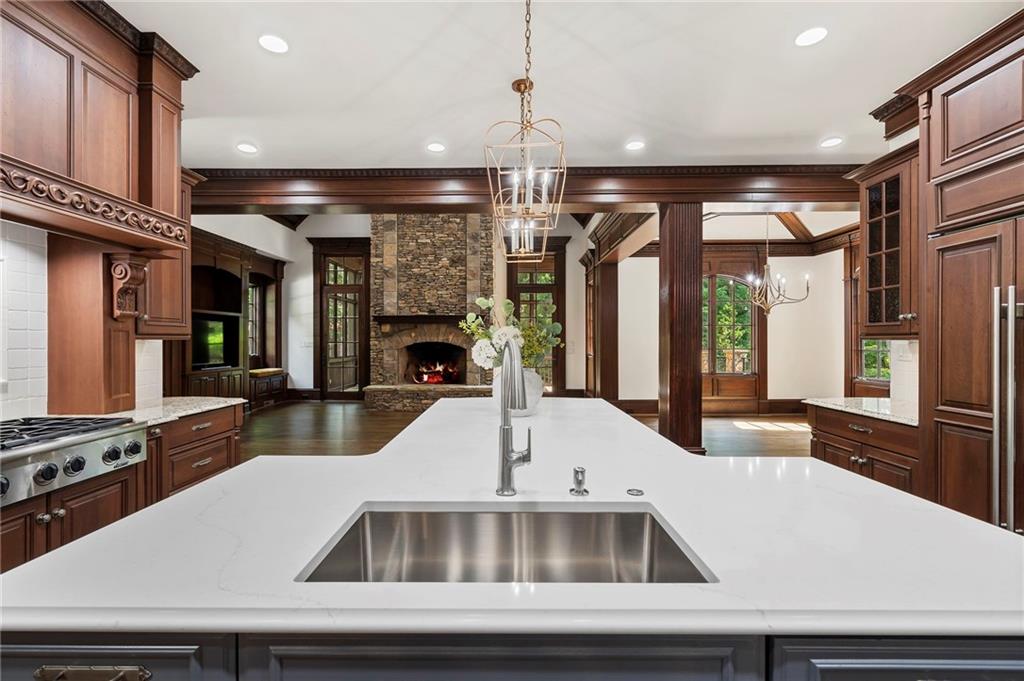 989 Middle Fork Trail Suwanee, GA 30024 - Photo 19 of 76 a view of kitchen with stainless steel appliances granite countertop a sink and a refrigerator