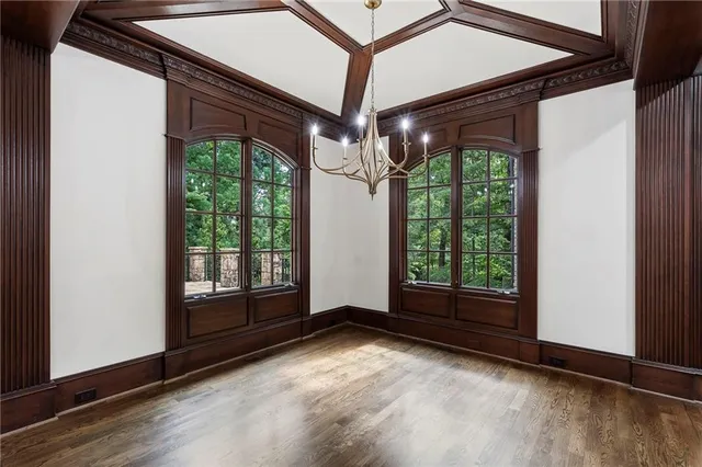 a view of room with window and hardwood floor