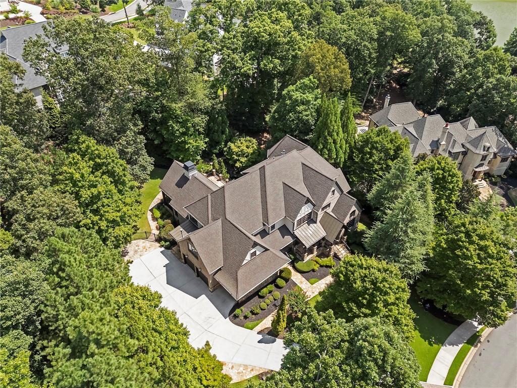 989 Middle Fork Trail Suwanee, GA 30024 - Photo 4 of 76 an aerial view of a house with a yard and trees