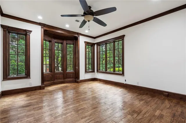 an aerial view of a house with swimming pool and outdoor seating