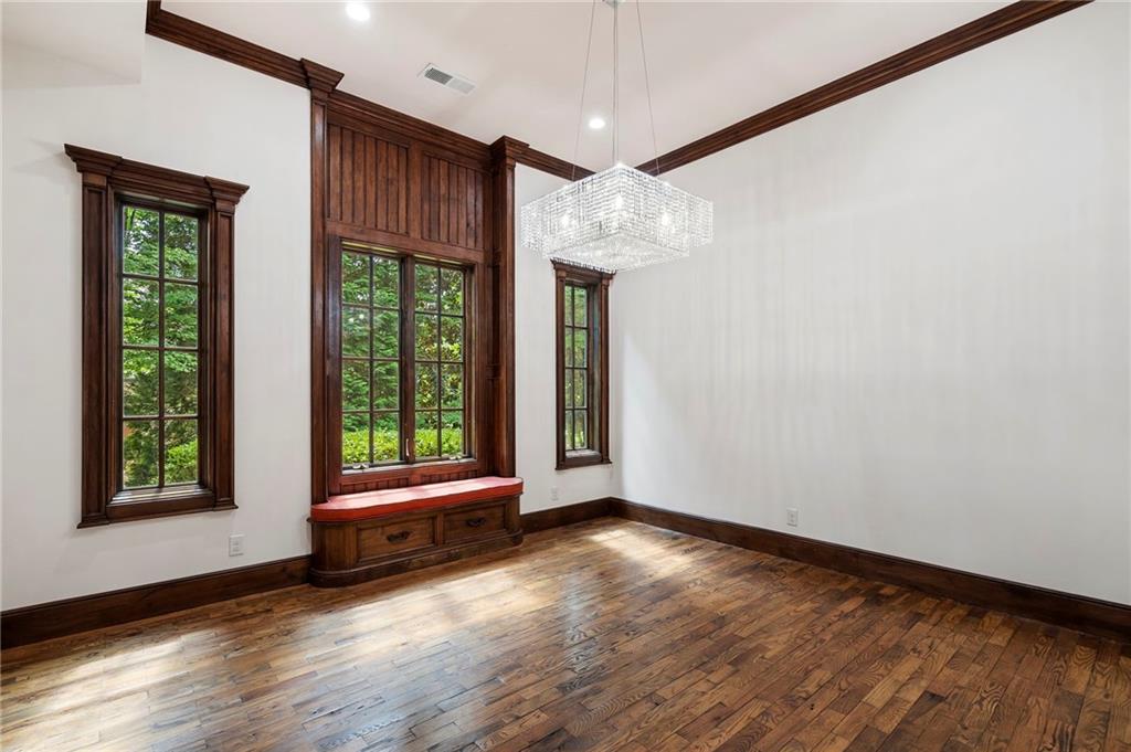 989 Middle Fork Trail Suwanee, GA 30024 - Photo 42 of 76 a view of room with window and hardwood floor