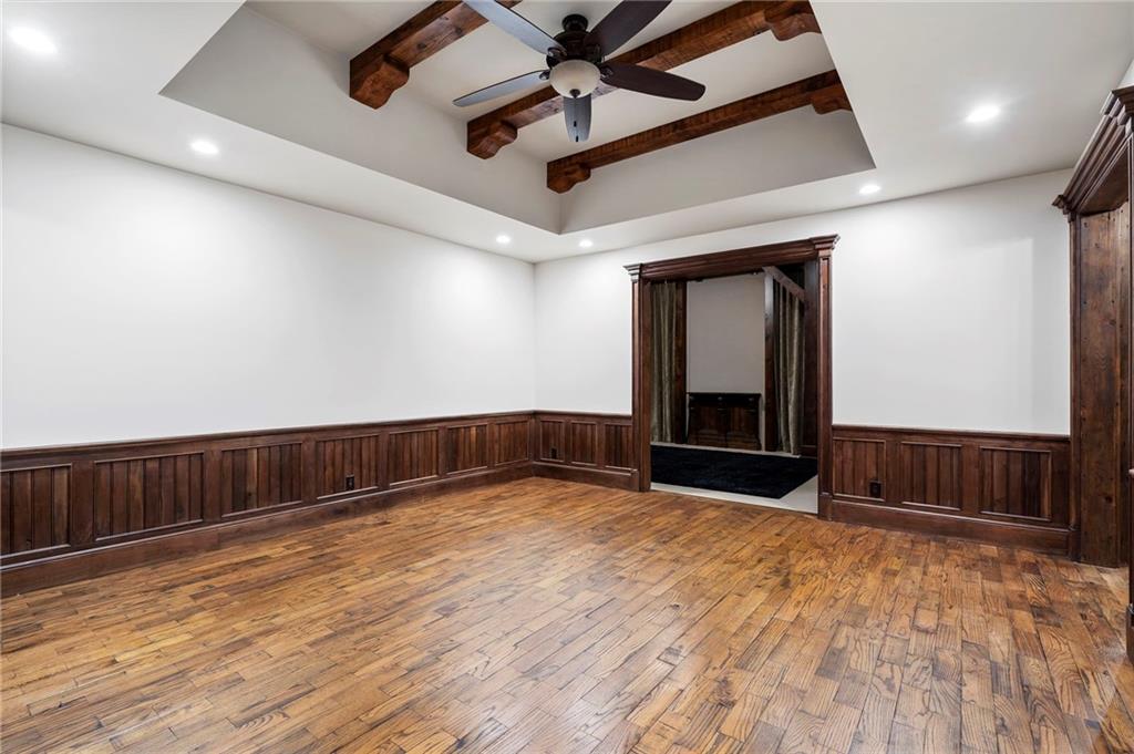 989 Middle Fork Trail Suwanee, GA 30024 - Photo 43 of 76 a view of an empty room with a fireplace and wooden floor