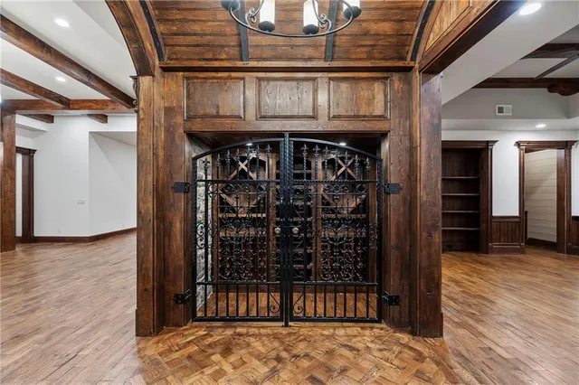 a living room with lots of furniture and chandelier