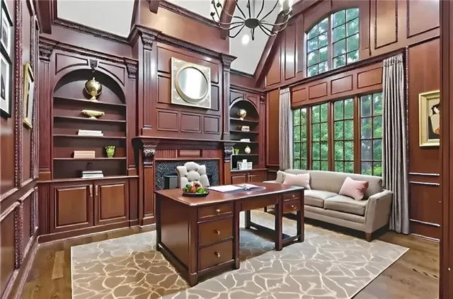 a living room with furniture and a large window with outer view