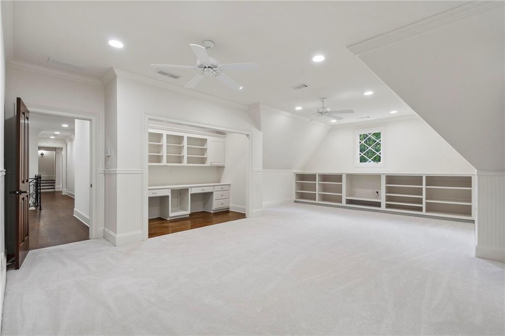 989 Middle Fork Trail Suwanee, GA 30024 - Photo 54 of 76 a view of a livingroom with a staircase